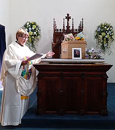 Revd. Liz conducting a funeral Revd. Liz conducting a funeral